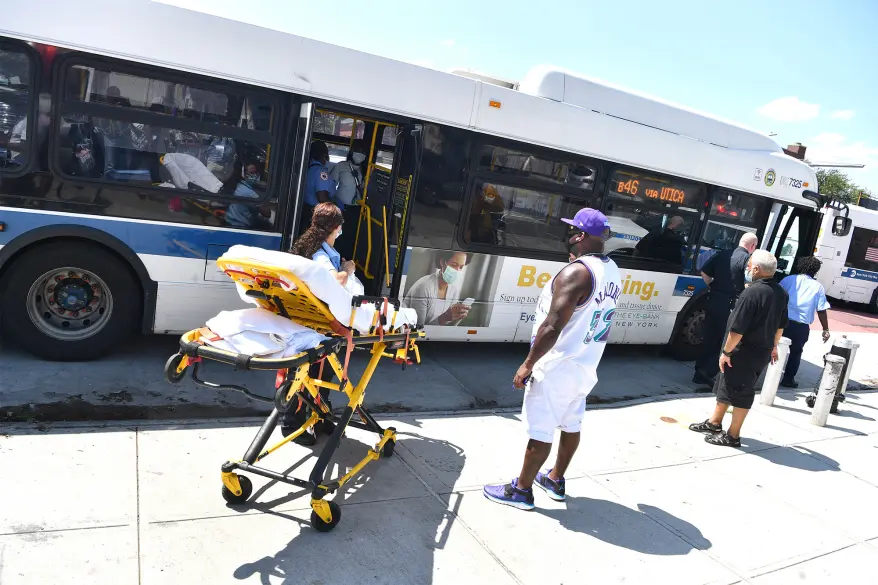 EMT with stretcher beside B46 bus after accident on Utica Avenue East Flatbush Brooklyn