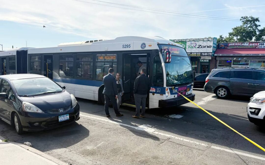 NYPD detectives investigating fatal shooting aboard MTA bus number 5295 on White Plains Road and East Tremont Avenue in the Bronx, New York, with yellow crime scene tape visible near the front of the bus